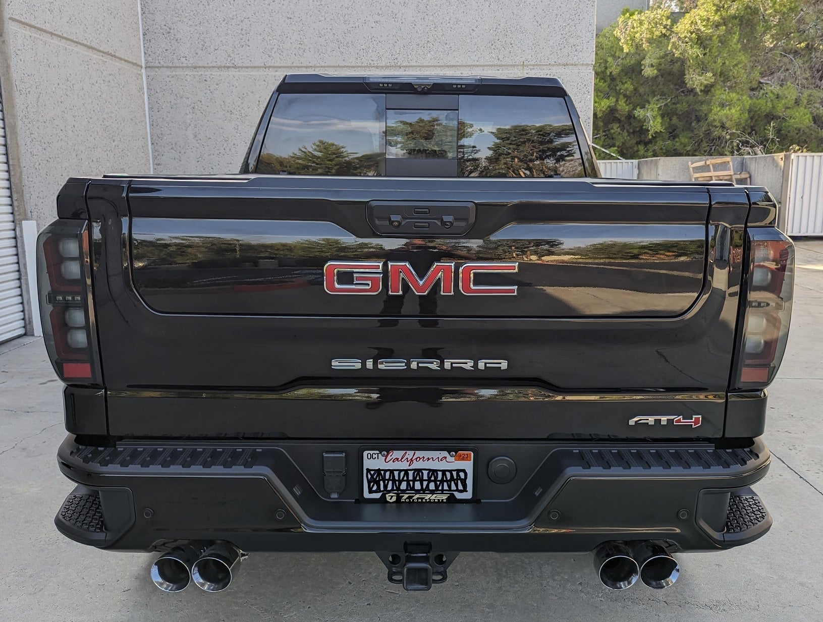 Smoked clear LED 3rd brake light for GMC Sierra and Chevy Silverado 2020-2026, installed on truck's rear window.
