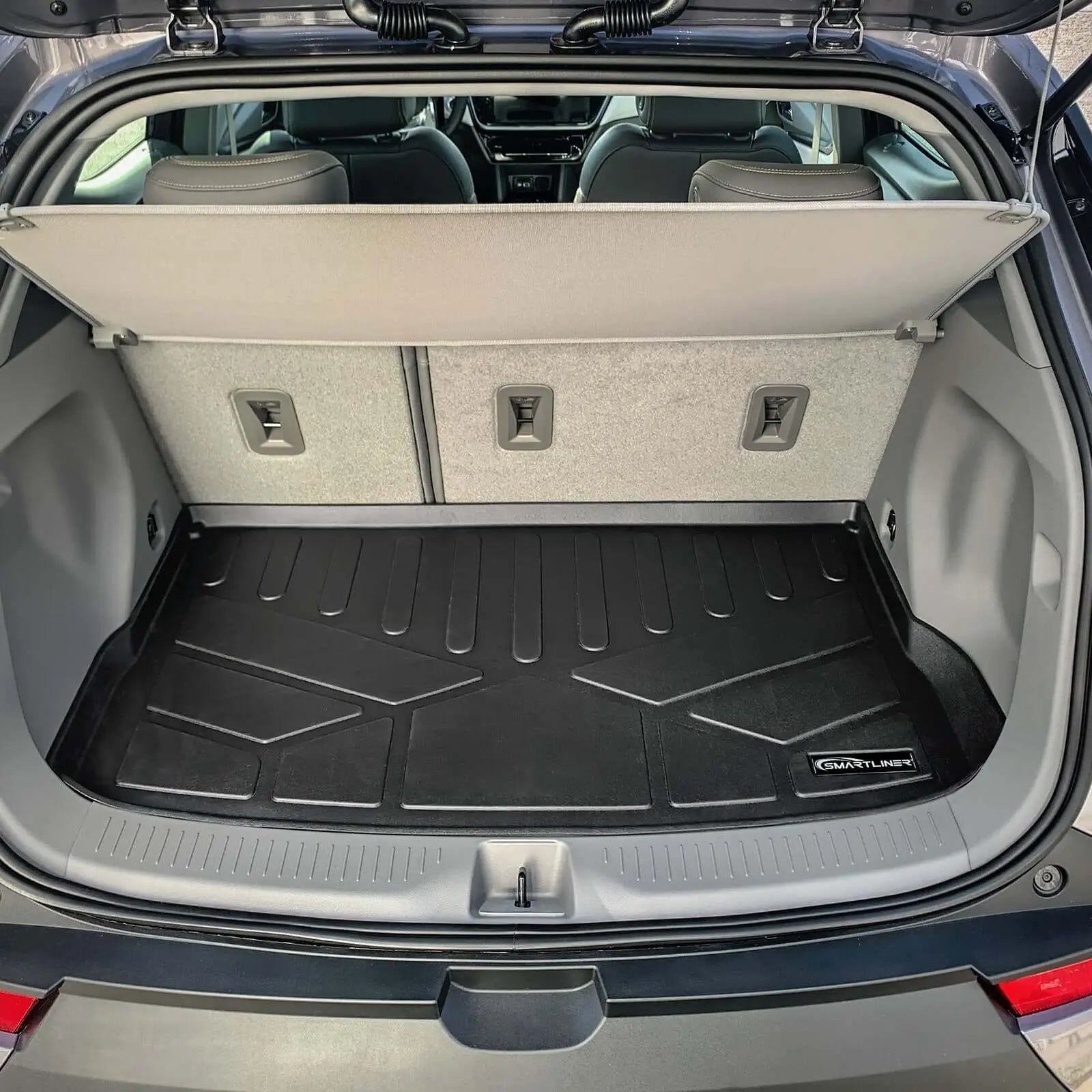 Smartliner USA exclusive floor liners for 2022-2024 Chevrolet Bolt EUV in upper deck cargo area, custom fit and durable material.