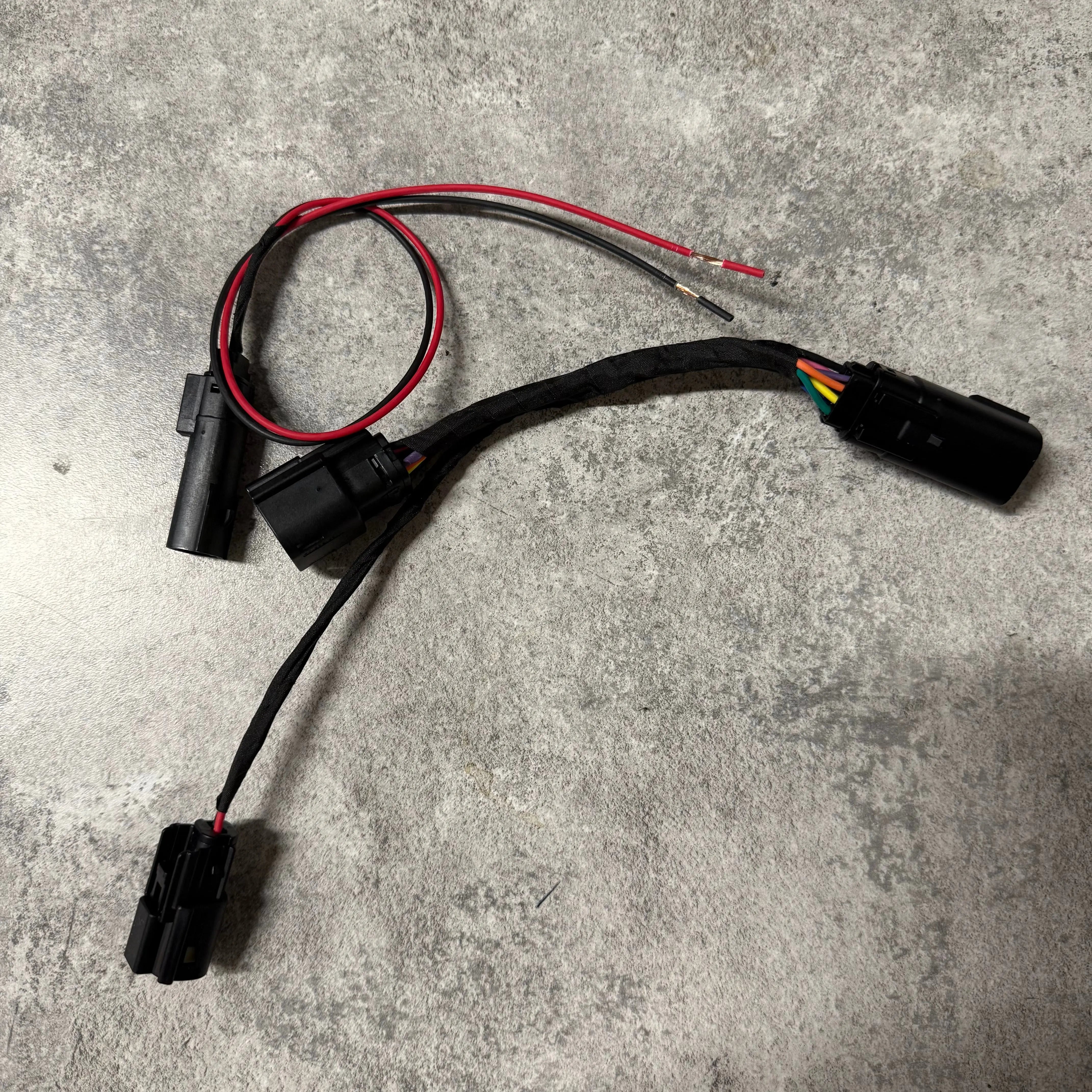 Gen5DIY headlight breakout harness for 2019-2021 Sierra 1500, showing the P&P harness with wiring connectors and components.