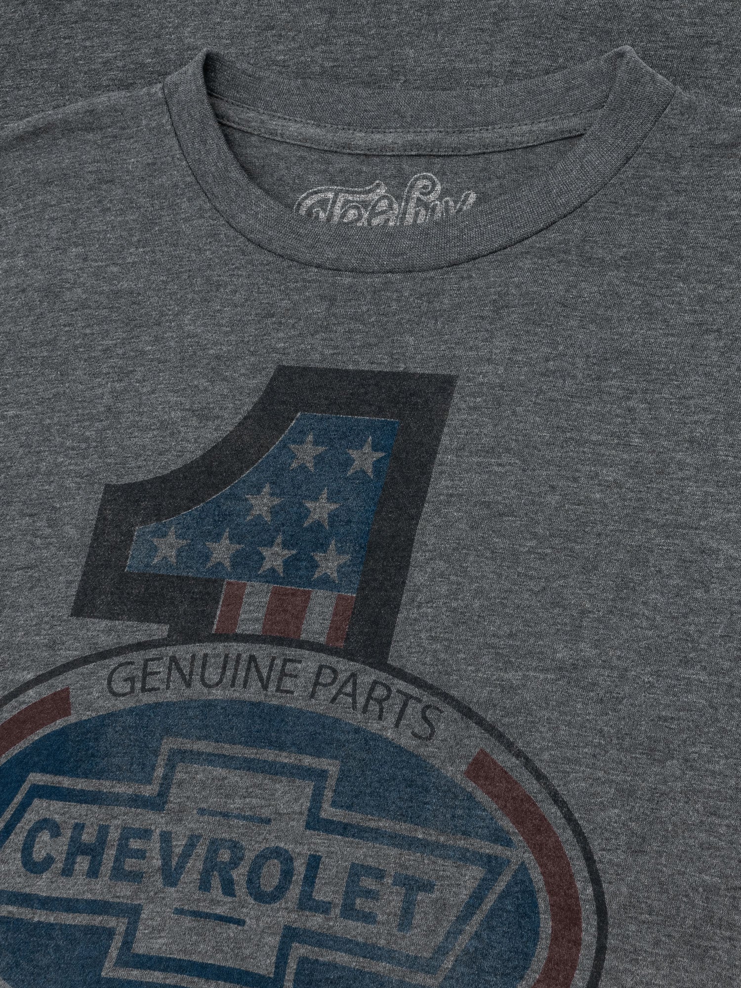 Gray men's Chevrolet T-shirt by Tee Luv featuring a Chevrolet logo graphic on the front.
