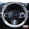 Cute universal leather steering wheel cover by Gm Service Guy with breathable design, shown fitted on a car steering wheel.