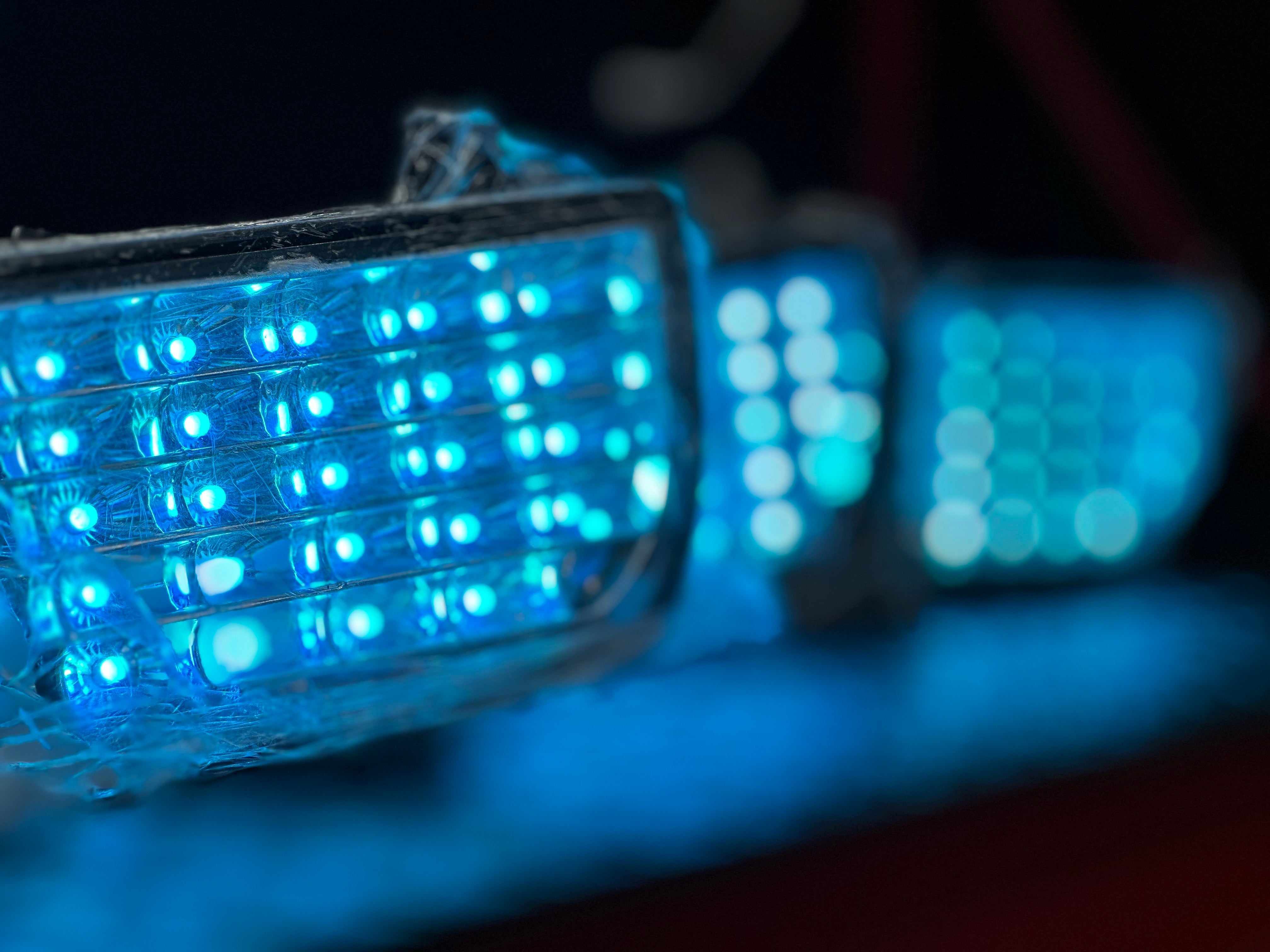 2010-2013 Chevy Camaro chrome tail lights with red and clear lenses by NTXGlow, showcasing the sleek automotive lighting upgrade.