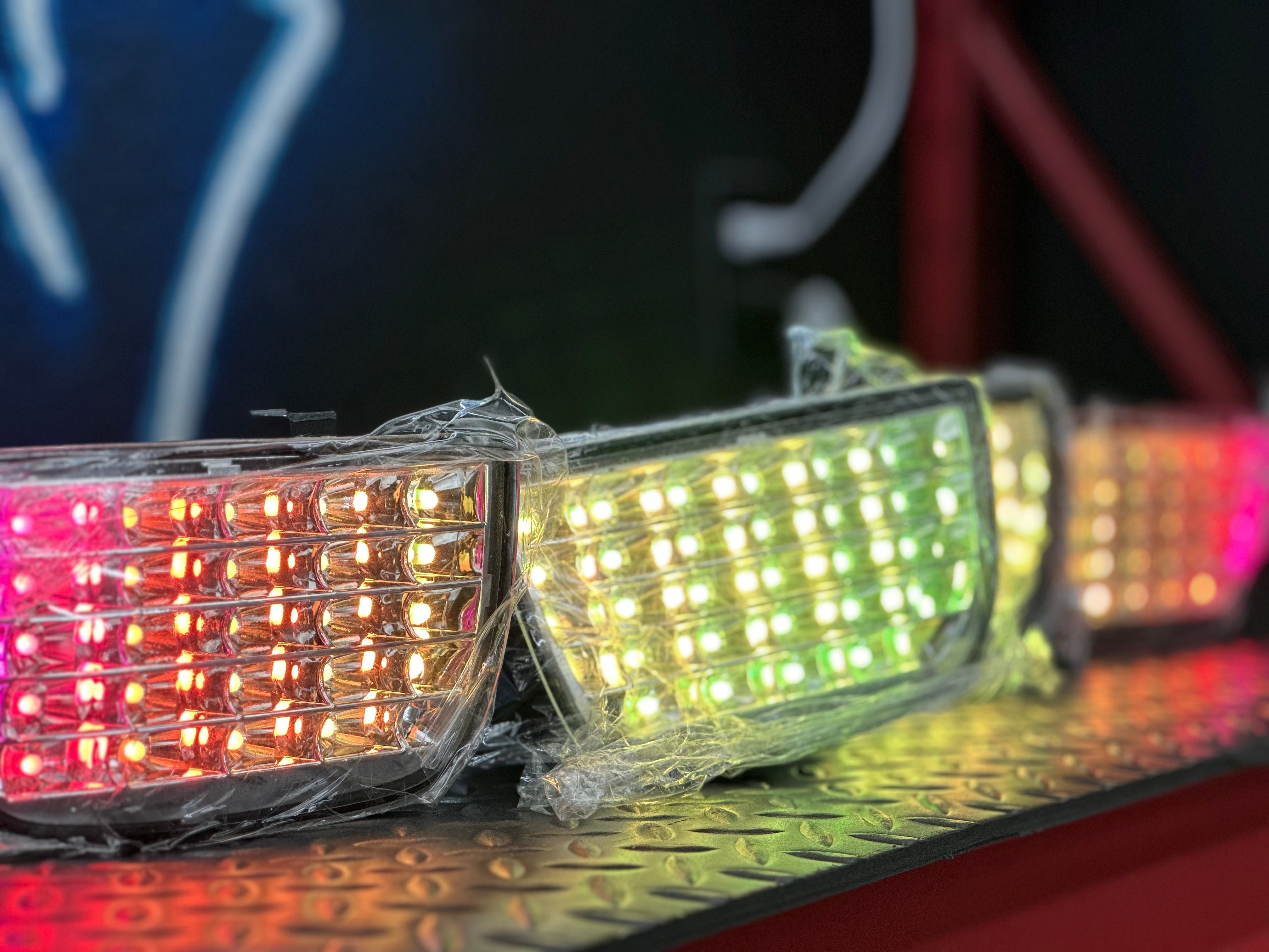 2010-2013 Chevy Camaro chrome RGB tail lights by NTXGlow, featuring sleek design and vibrant lighting for enhanced visibility.