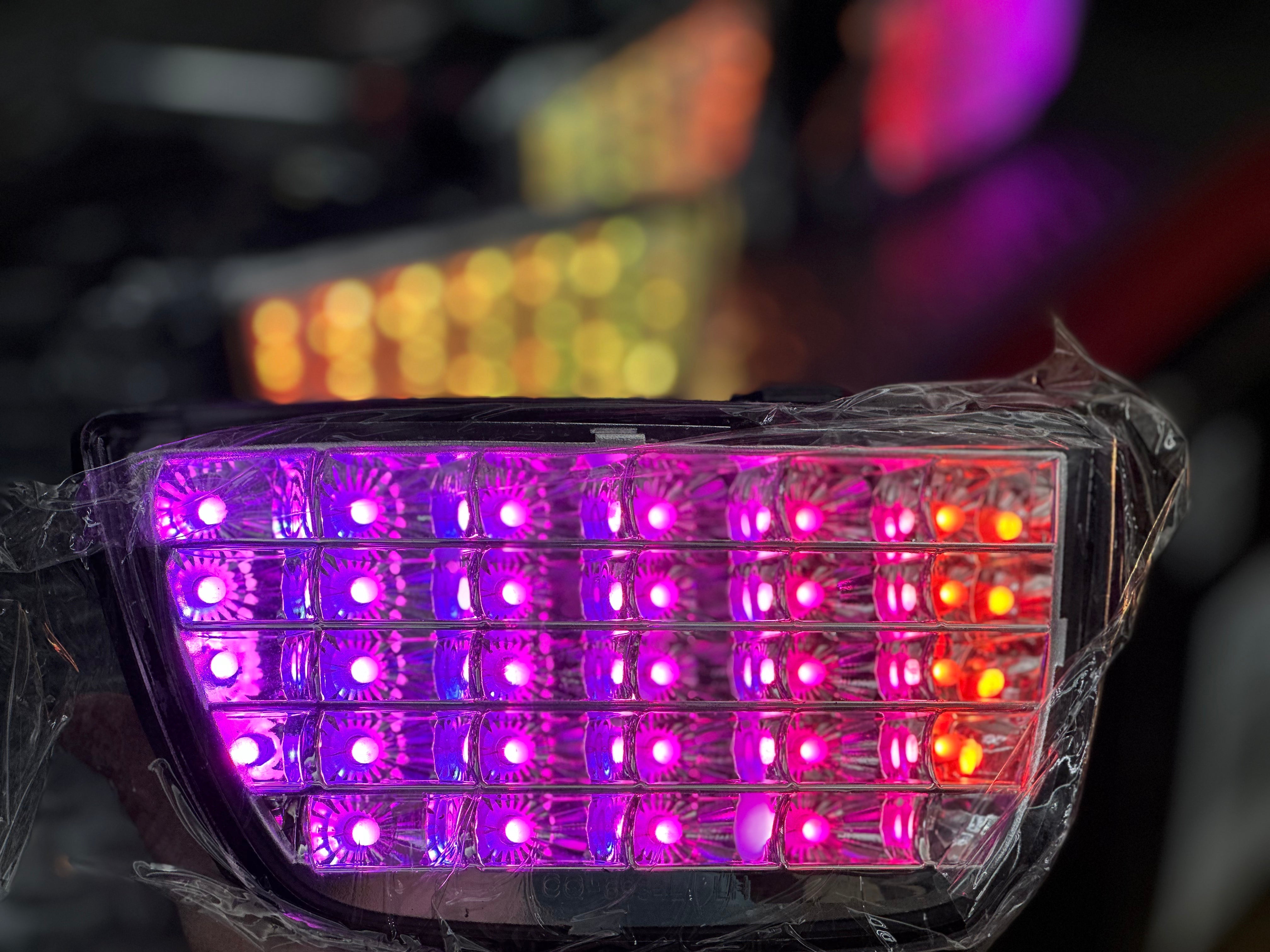 Chrome tail lights for 2010-2013 Chevy Camaro by NTXGlow, showing sleek, reflective design on a black background.
