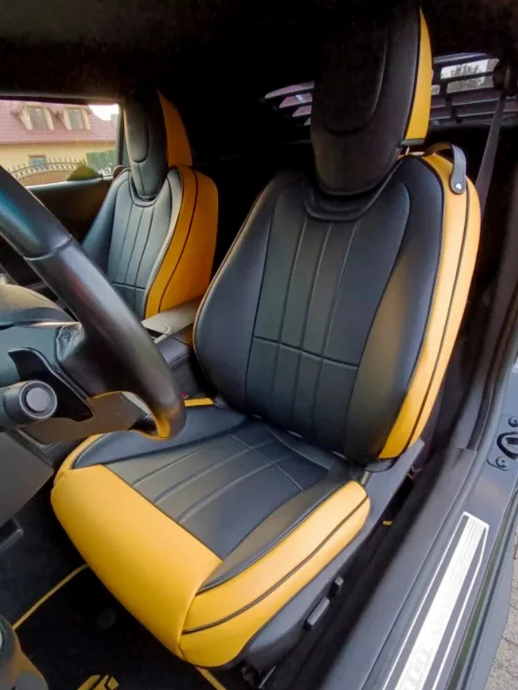 Set of custom-fit Chevrolet Camaro seat covers in premium artificial leather, designed for 2016-2024 models.