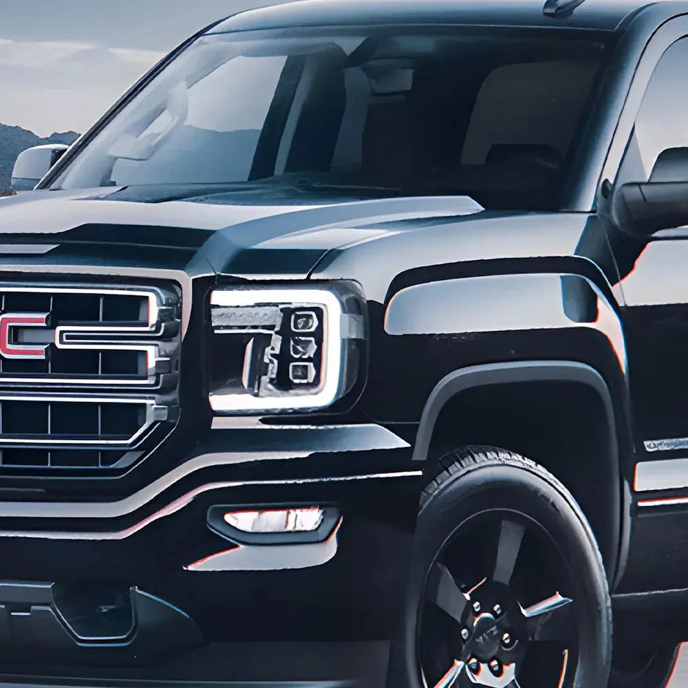 GMC Sierra 2007-2013 LED headlight assembly with high-quality dynamic triple lens, front view showing clear lens and modern design