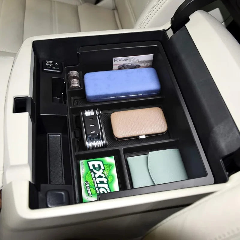 Gm Service Guy upgraded console organizer tray for Chevy Silverado and GMC Sierra 1500, 2500, 3500HD models, showing interior storage.