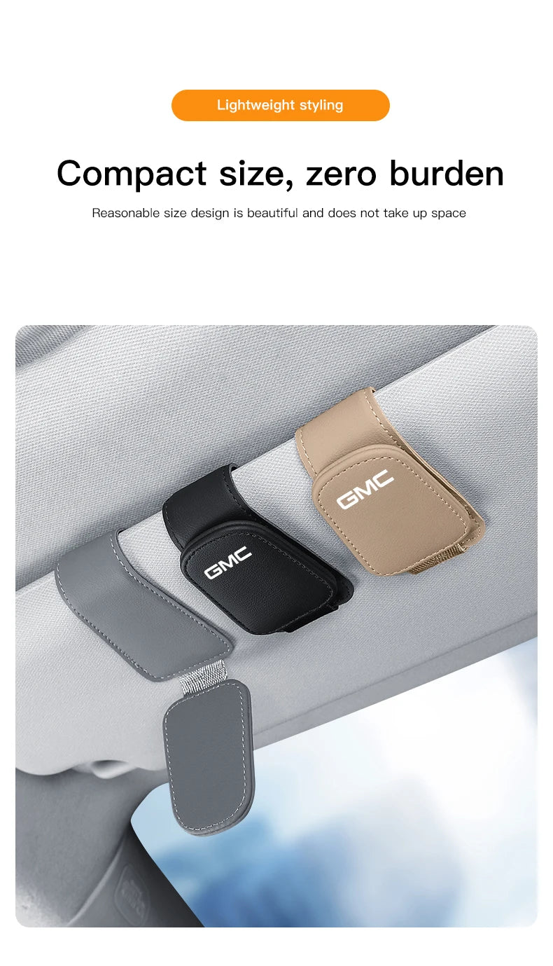 GMC car sunglass holder accessory for Terrain, Sierra, Yukon, Acadia, Savana, Hummer, and H3 models installed on vehicle interior.