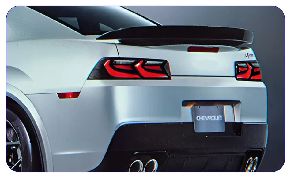 Chevrolet Camaro 2014-2020 LED rear taillights assembly with highlighted blink turn signals, installed on the back of the car.