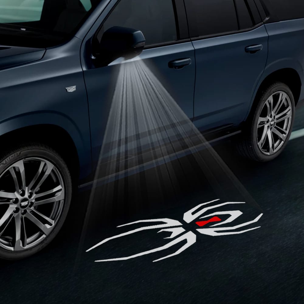 Pair of Cadillac Escalade 4th/5th gen premium under side mirror projector puddle lights with black widow design, for 2015-2026.