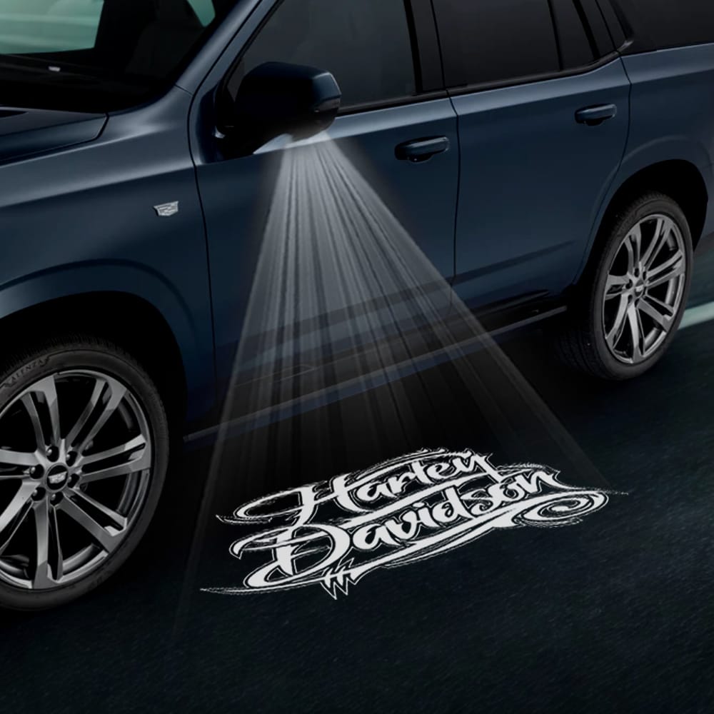 Pair of Cadillac Escalade premium under side wing mirror projector puddle lights with Harley-Davidson logo, custom door courtesy lights 2015-2026.