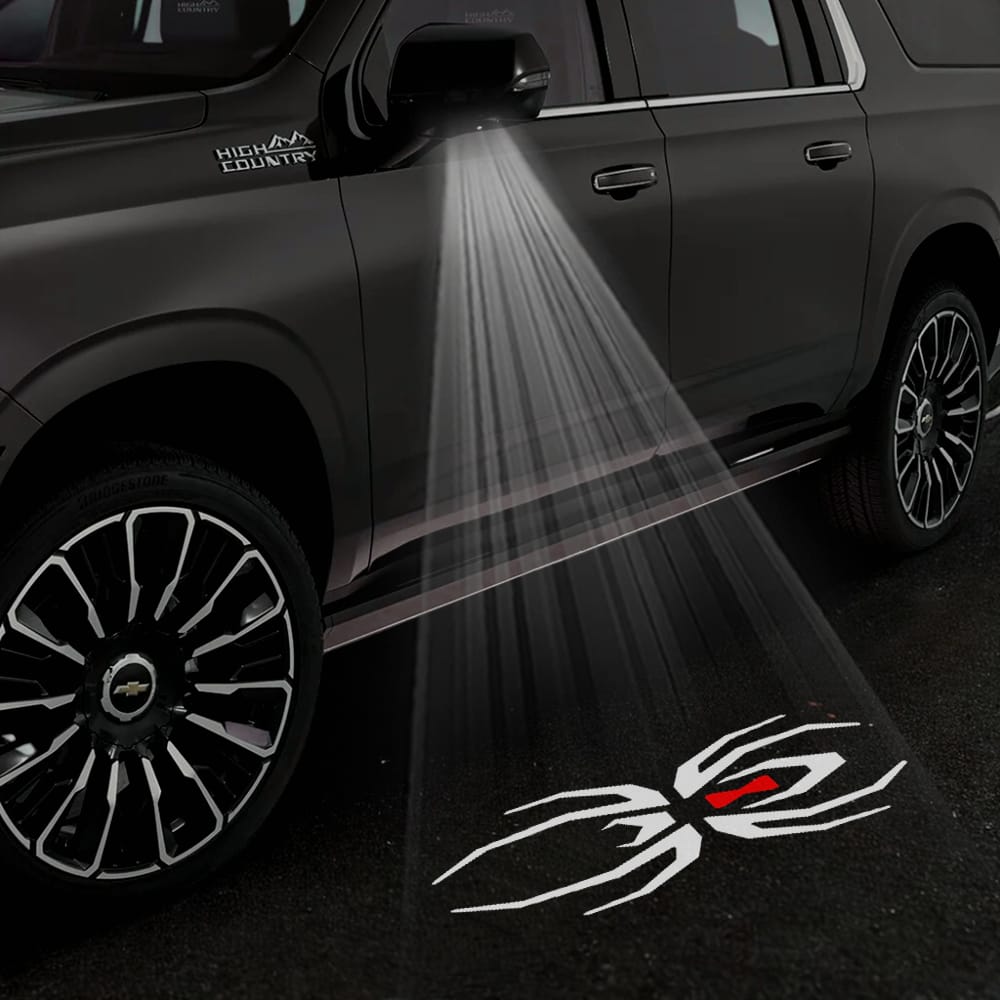 Pair of Chevrolet Suburban 11th/12th Gen Custom Puddle Lights with under side wing mirror projector designs, black widow edition, for 2015-2026.