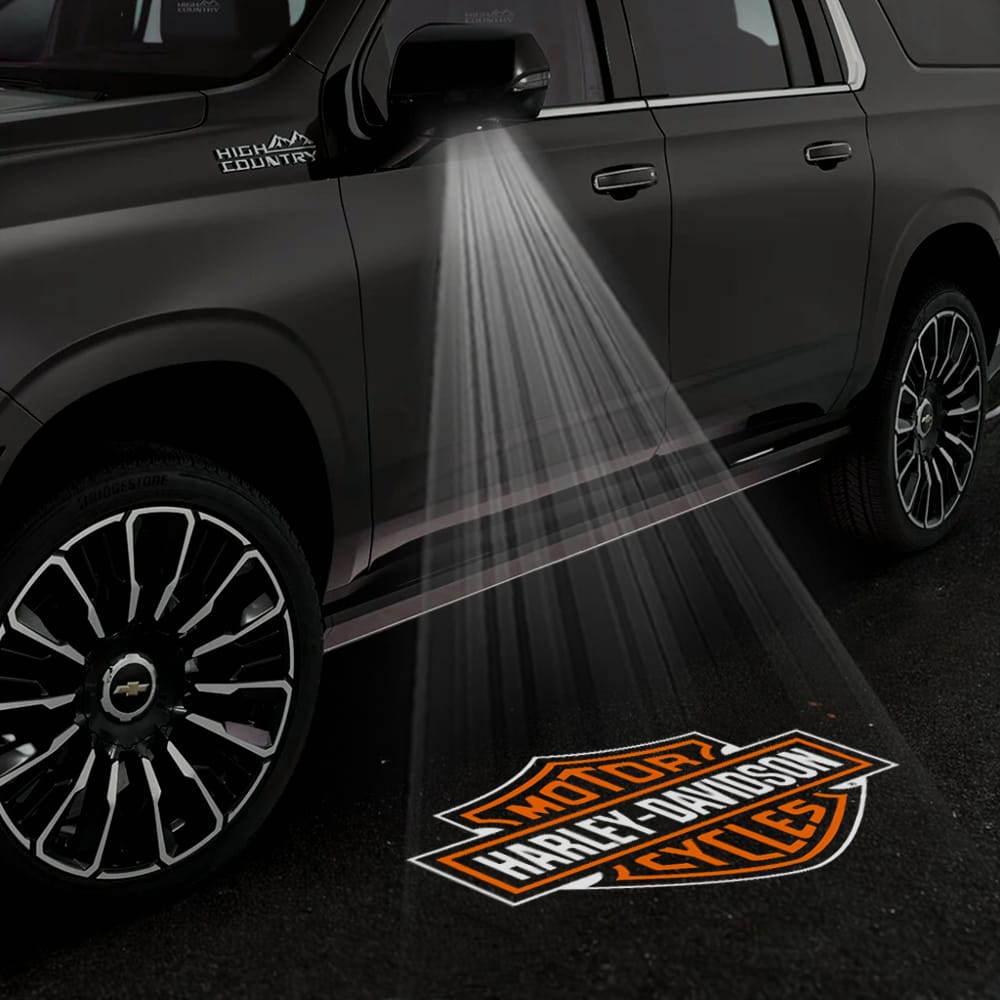 Pair of Chevrolet Tahoe 4th/5th gen Custom Puddle Lights with logo projectors on side mirrors, designed for 2015-2026 models.