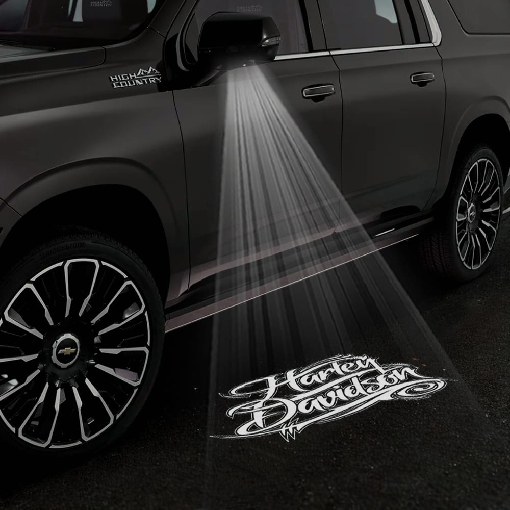 Pair of Chevrolet Suburban 11th/12th Gen premium under-side mirror projector puddle lights with Harley Davidson logo, for 2015-2026 models.