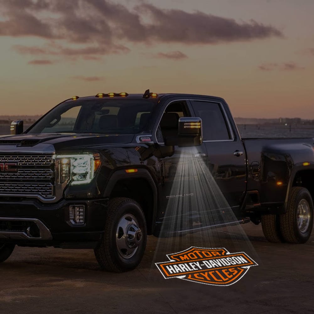 Pair of GMC Sierra custom side mirror puddle lights with Harley-Davidson logo designs, fitting 2015-2026 models.