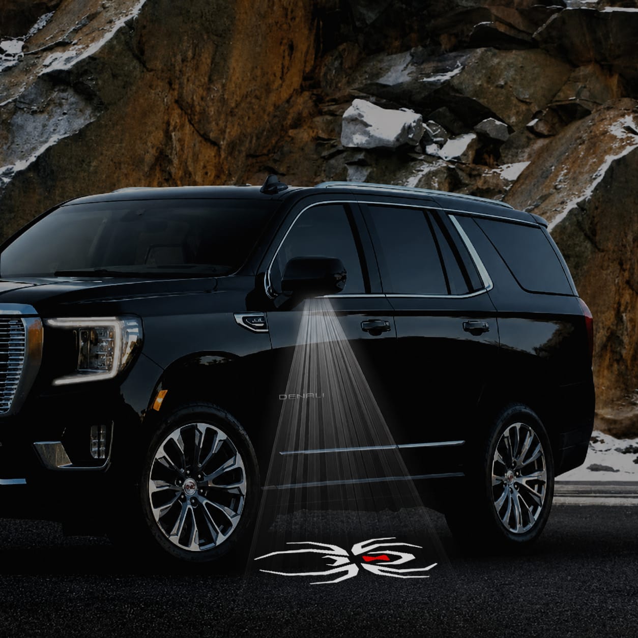 Pair of GMC Yukon premium side wing mirror puddle lights by Custom Puddle Lights, black widow edition, for 2015-2026 models.